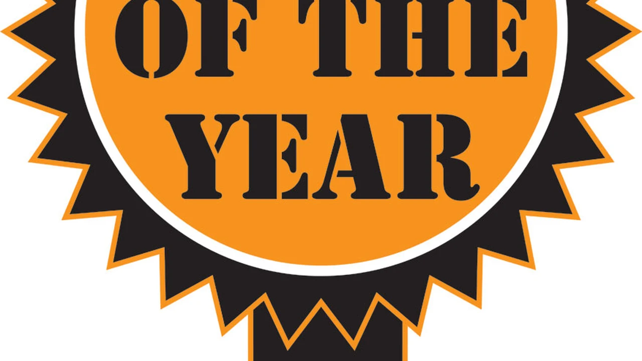 Close up on a plate of mashed potatoes, topped with baked pork chops with cream of mushroom soup, and a side of green beans.