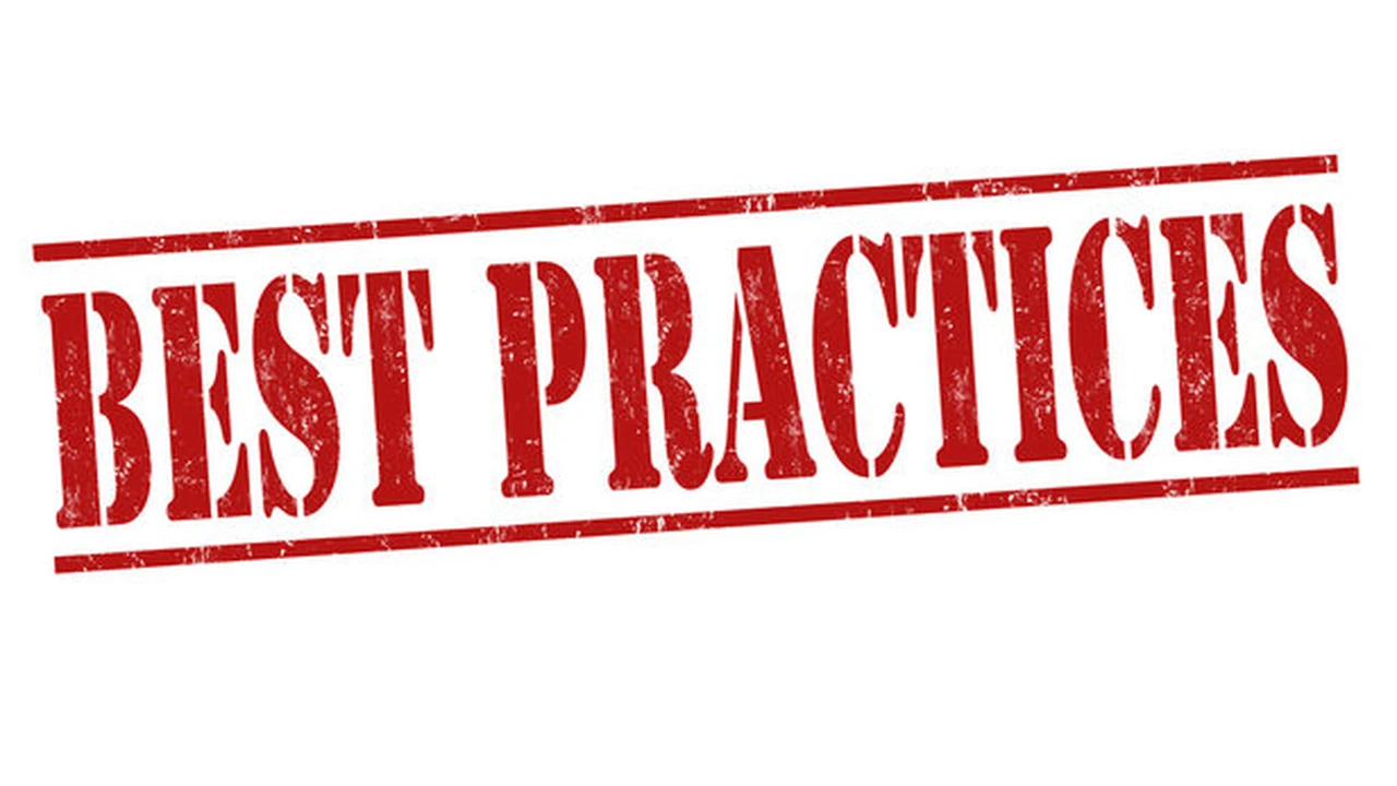 Close up on a plate of mashed potatoes, topped with baked pork chops with cream of mushroom soup, and a side of green beans.