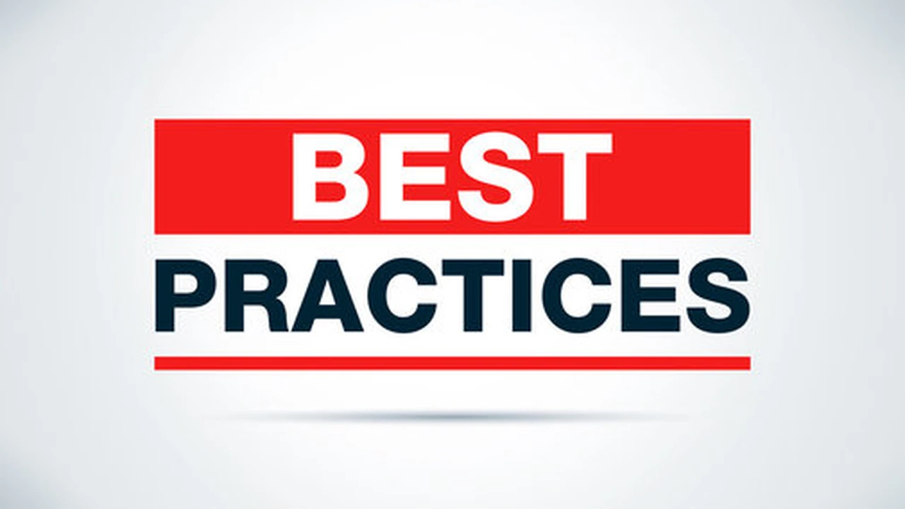 Close up on a plate of mashed potatoes, topped with baked pork chops with cream of mushroom soup, and a side of green beans.