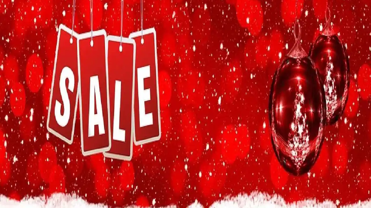 Close up on a plate of mashed potatoes, topped with baked pork chops with cream of mushroom soup, and a side of green beans.