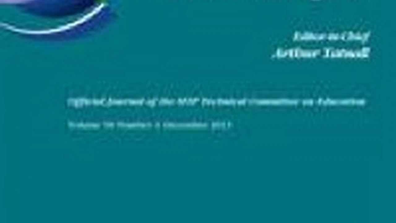 Close up on a plate of mashed potatoes, topped with baked pork chops with cream of mushroom soup, and a side of green beans.